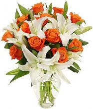 Vase of Orange Roses and White Oriental Lilies